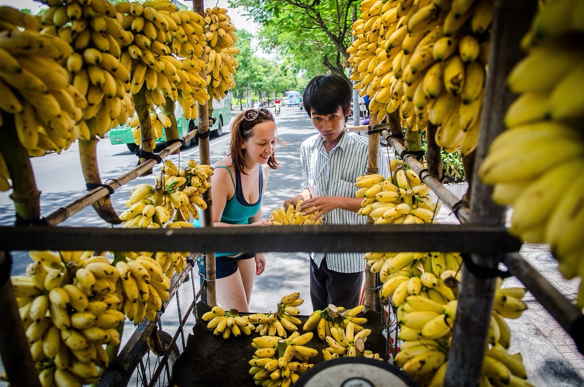 Vietnam street food market with colorful vendors and dishes