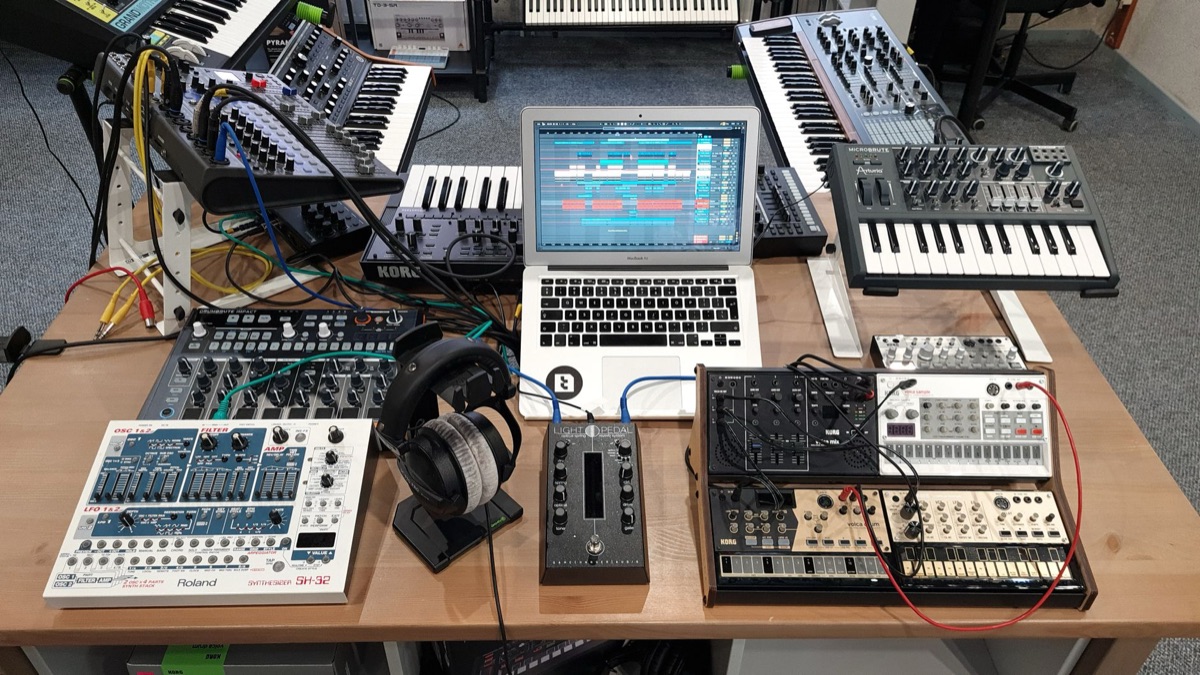 Music studio with headphones and laptop