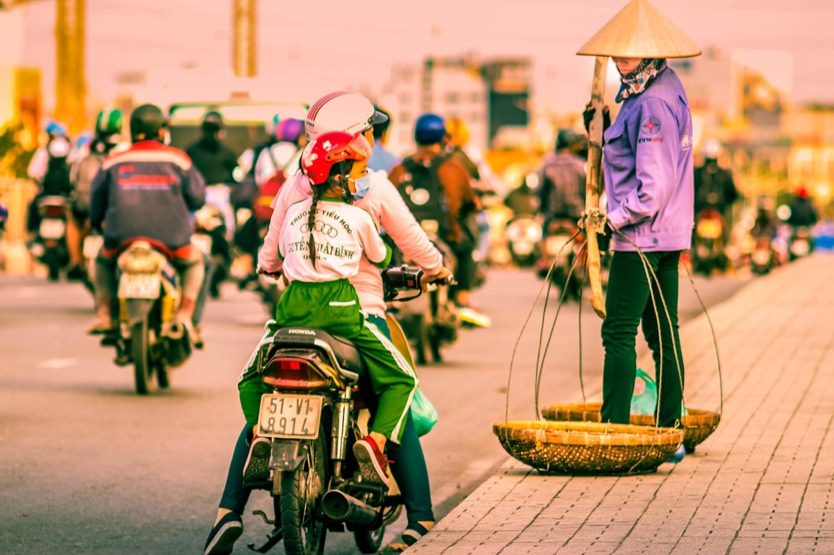 Vietnam street vendor in bustling market