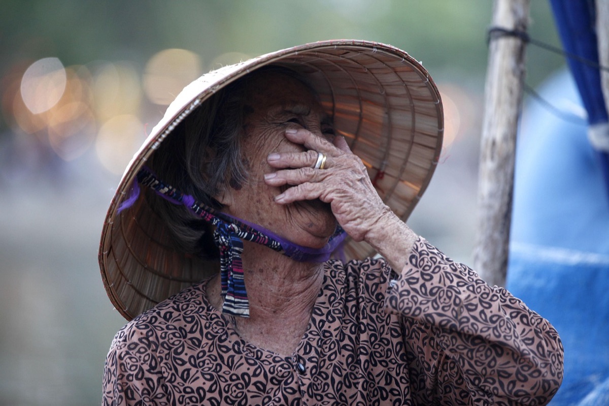Vietnam street vendor with traditional hat