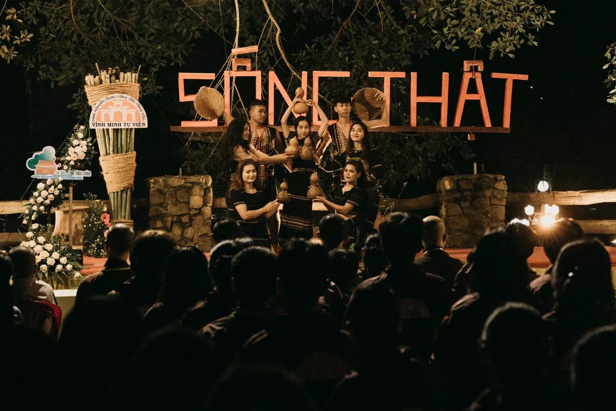 People gather for an evening cultural performance with traditional music and dance.